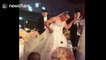 Groom wears dress and bride wears tuxedo at bizarre Chinese wedding