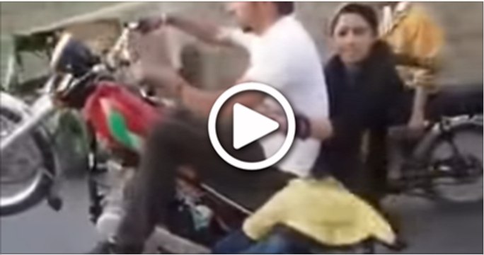 Pakistani-Boy-With-A-Girl-Doing-One-Wheeling-On-Bike