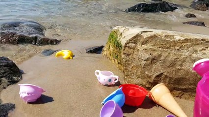 Kids playing on the beach . They making ice cream and cakes from sand. Video 2016