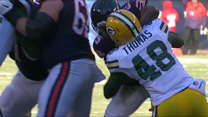 Joe Thomas knocks the Bears logo off Ka'Deem Carey's helmet