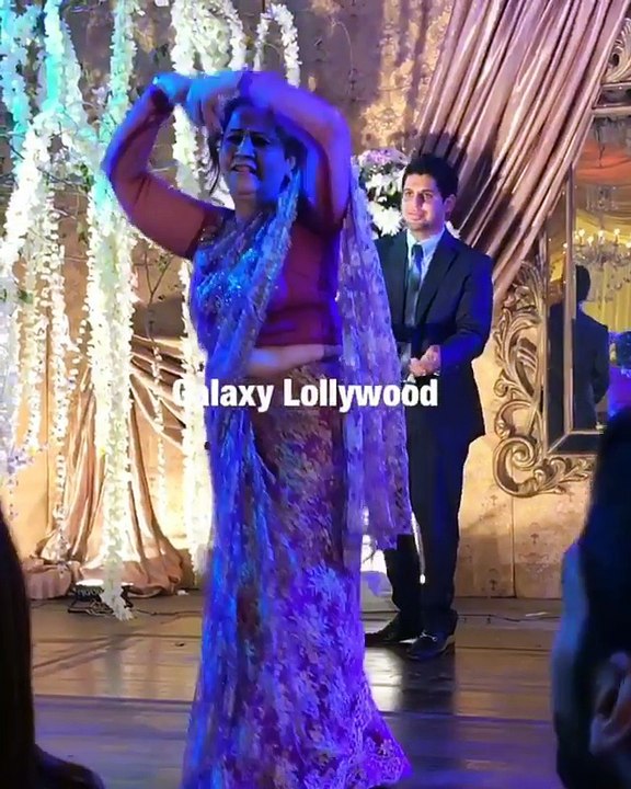 Farhan Saeed dancing along with his khala at the Urwa Hocane & Farhan Saeed wedding reception in Lahore