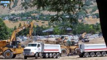 Construction Site Loader loading double dump truck excavator working
