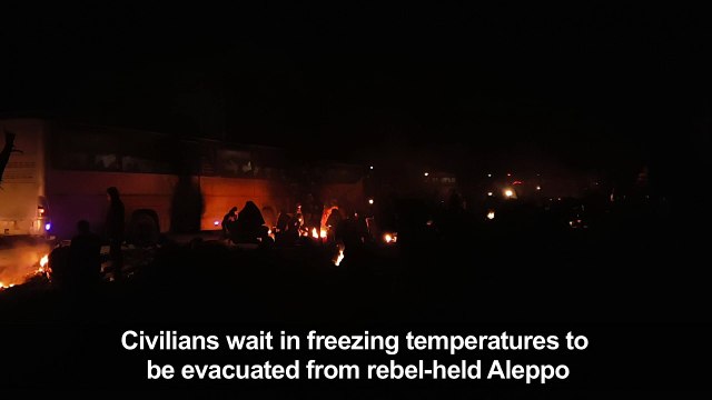 Civilians wait to be evacuated from rebel-held Aleppo