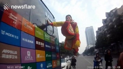 Man hangs off side of coach in 'Monkey King' costume