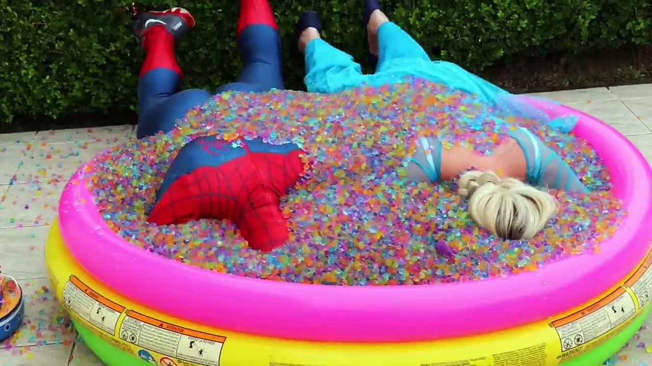 Frozen Elsa & Spiderman Buried Head in Orbeez sand surprise vs Joker Pranks Fun Superhero Real Life--Nwprb-JQFg