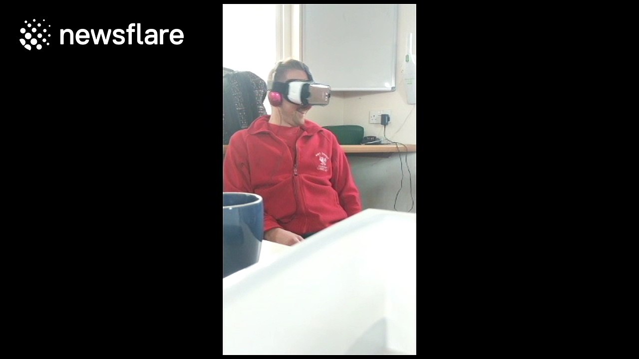 Man falls off chair while playing scary virtual reality game