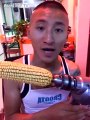 Asian dude lost his tooth eating corn with a drill