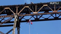 Guatemalan Firefighter Abseils Down Bridge to Give GIfts to Poor Children