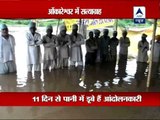 Water rising up to the necks of Omkareshwar villagers protesting forced evictions