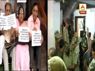 Left MP's sit-in protest outside parliament against chit fund scam