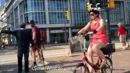 Physical altercation between cyclist and pedestrian at crosswalk