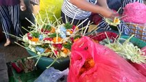 arranging flowers for offerings in bali