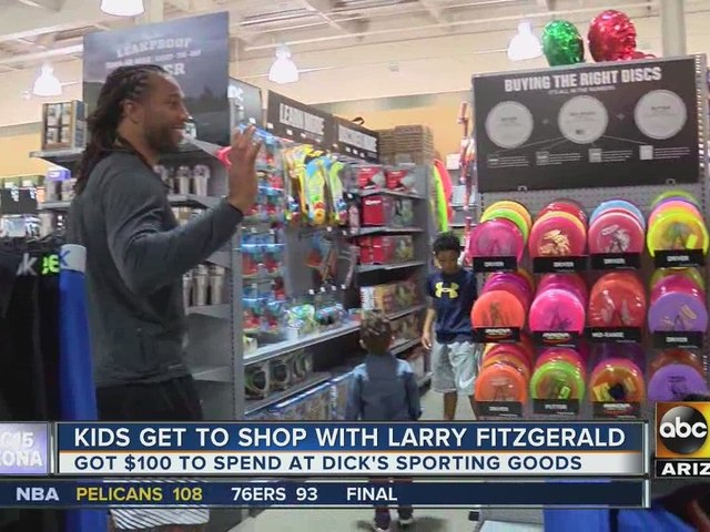 Larry Fitzgerald takes kids on shopping spree