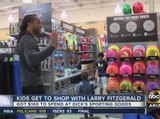 Arizona Cardinals’ Larry Fitzgerald gives kids shopping spree