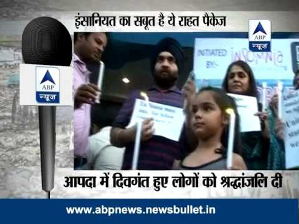 Candle march & relief materials for flood-affected areas of Uttarakhand