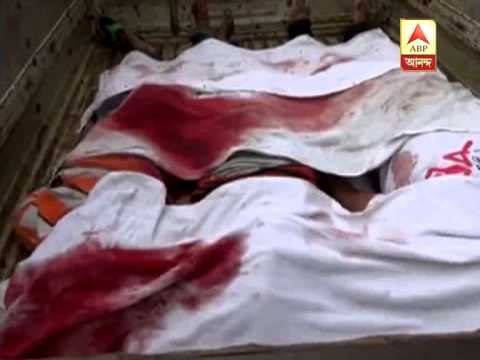 A car heavily damaged as a lorry rammed into it, leading to death of some people.