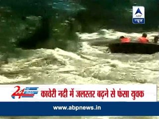 Rise in water level in kaveri river :youth stucked