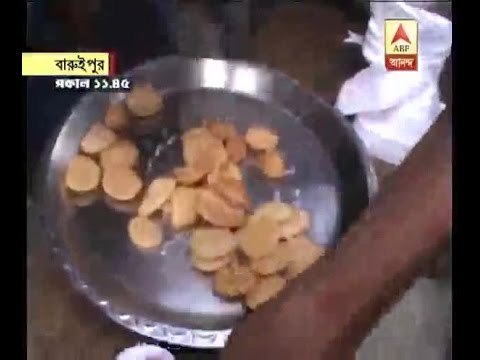 food, sweets distributed outsides booth at Baruipur