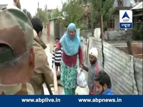 Indian army jawans assisting flood-affected Kashmiris
