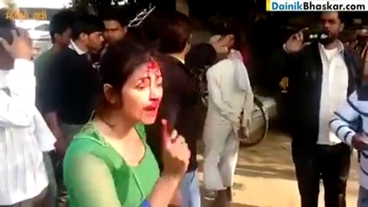 A guy Badly Beat Woman with Bamboo Stick in Public