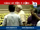 PM Narendra Modi helps a journalist regain his balance