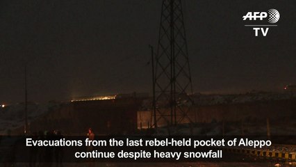 Aleppo evacuations resume in snow after delay