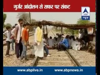 Must Watch: Men build temporary huts and protest on the railway lines