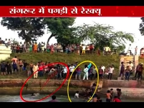 Watch Sikh men use their turbans to save the lives of two drowning youths during Ganesha v