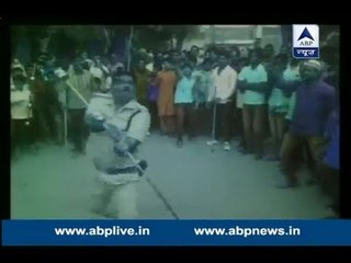 Policeman perform stunts during a Muharram procession in Madhya Pradesh
