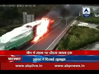 Truck in flames dashes out of tunnel in China