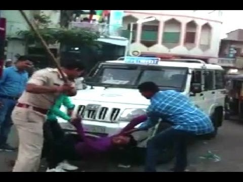 Surat police beat up two alleged eve teasers publicly