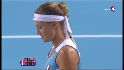 Kiki's outfit perfectly matches the colour of the court!