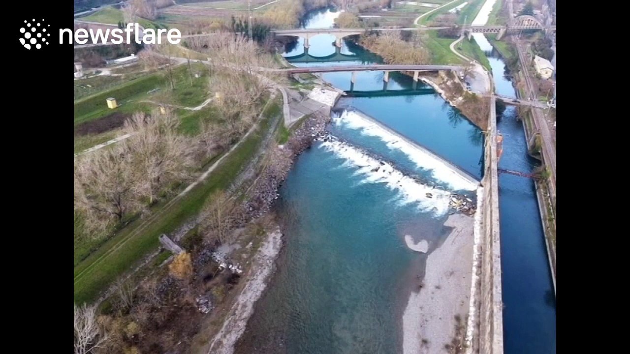 Wintery aerial shot of river in Tuscany