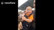 15-month-old child gets incredibly excited about live motor racing