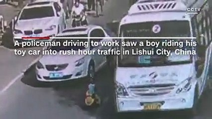 Watch this boy dodge rush-hour traffic in his toy car