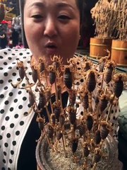 China lady eat scorpian at open- amazing and shocking video