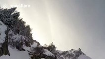 Impressive wingsuit flight above Alpine glacier