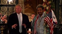 Flanked by Don King, Trump answers reporter questions
