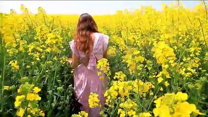 Young Woman in Vintage Dress Running Field