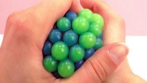 Antistress visqueux – Balle| Squishy Mesh Ball bleue et vert fluo | Balle molle dans un filet | Démo