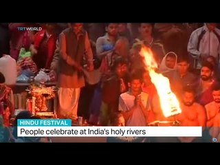 People celebrate at India's holy rivers