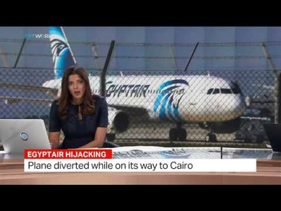 Egyptian Minister of Civil Aviation Sherif Fathy holding press conference on hijacked plane