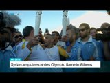 Syrian amputee carries Olympic flame in Athens