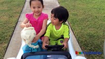 Kid Playing Outside riding car blowing bubbles with Giant Frozen Elsa Doll Ryan ToysReview