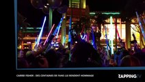 Mort de Carrie Fisher : Armés de sabres lasers, des centaines de fans de Star Wars lui rendent...