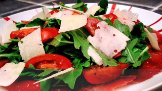 Bresaola Carpaccio topped with a Tomato and Arugula Salad