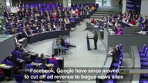 Merkel warns against fake news driving populist gains-ONPG_iJnfGk