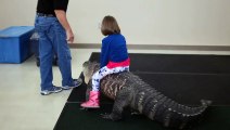 Small Girl Rides A Crocodile -- Unbelievable