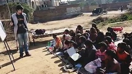 Rohayl Varind teaching his students Alphabets