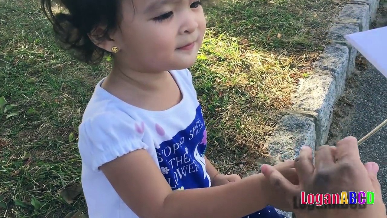 Toddler learning ABC Alphabets on a White Flags _ Fun outdoors park-nQaIsXvJuGA